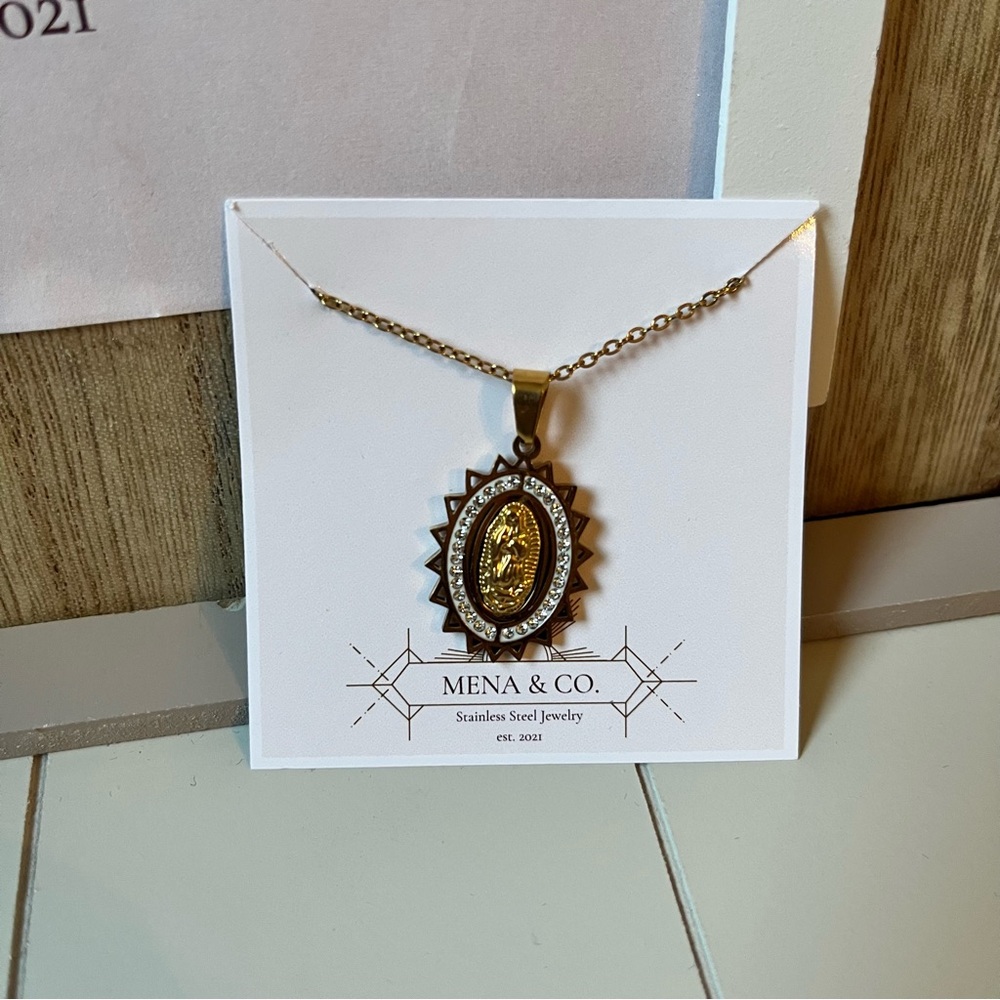 Stainless Steels Gold Virgen de Guadalupe Pendant Necklace with silver accents.